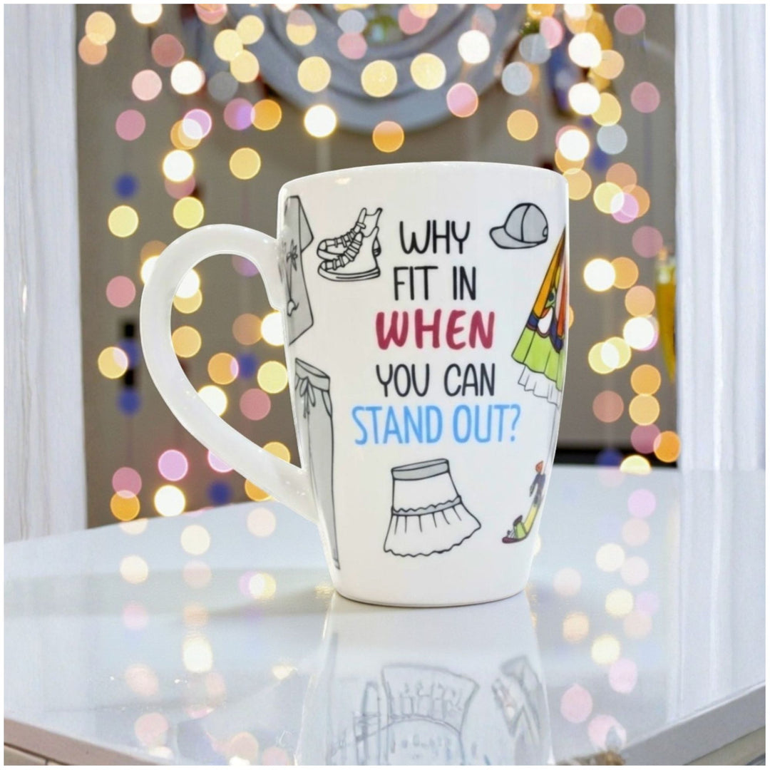 Ceramic Mug with motivational quote 'Why Fit In When You Can Stand Out" and sketches of clothes 