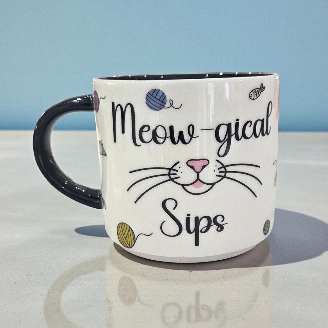 Mug with 'Meow-gical Sips' text and cat-themed design